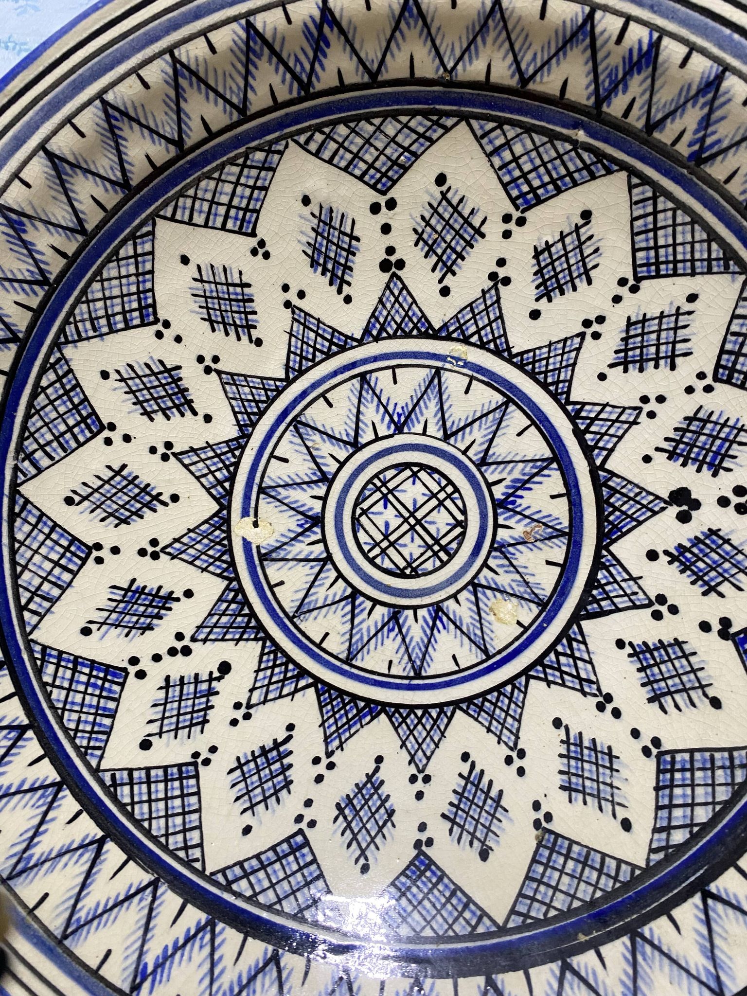 Moroccan dish in handcrafted sculpted ceramic, blue geometric patterns and