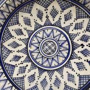 Moroccan dish in handcrafted sculpted ceramic, blue geometric patterns and