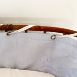 Vintage rattan cradle and its wheeled support