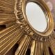 Vintage sun mirror in golden resin 60s/70s