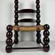 Brutalist wood turned bobbin low rush chair n the style of Charles Dudouyt