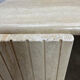 Table basse travertin forme œil par Roche Bobois