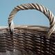 Very large oval laundry basket in two-tone braided wicker with handles