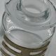 Two vintage 70s glass and metal bottles