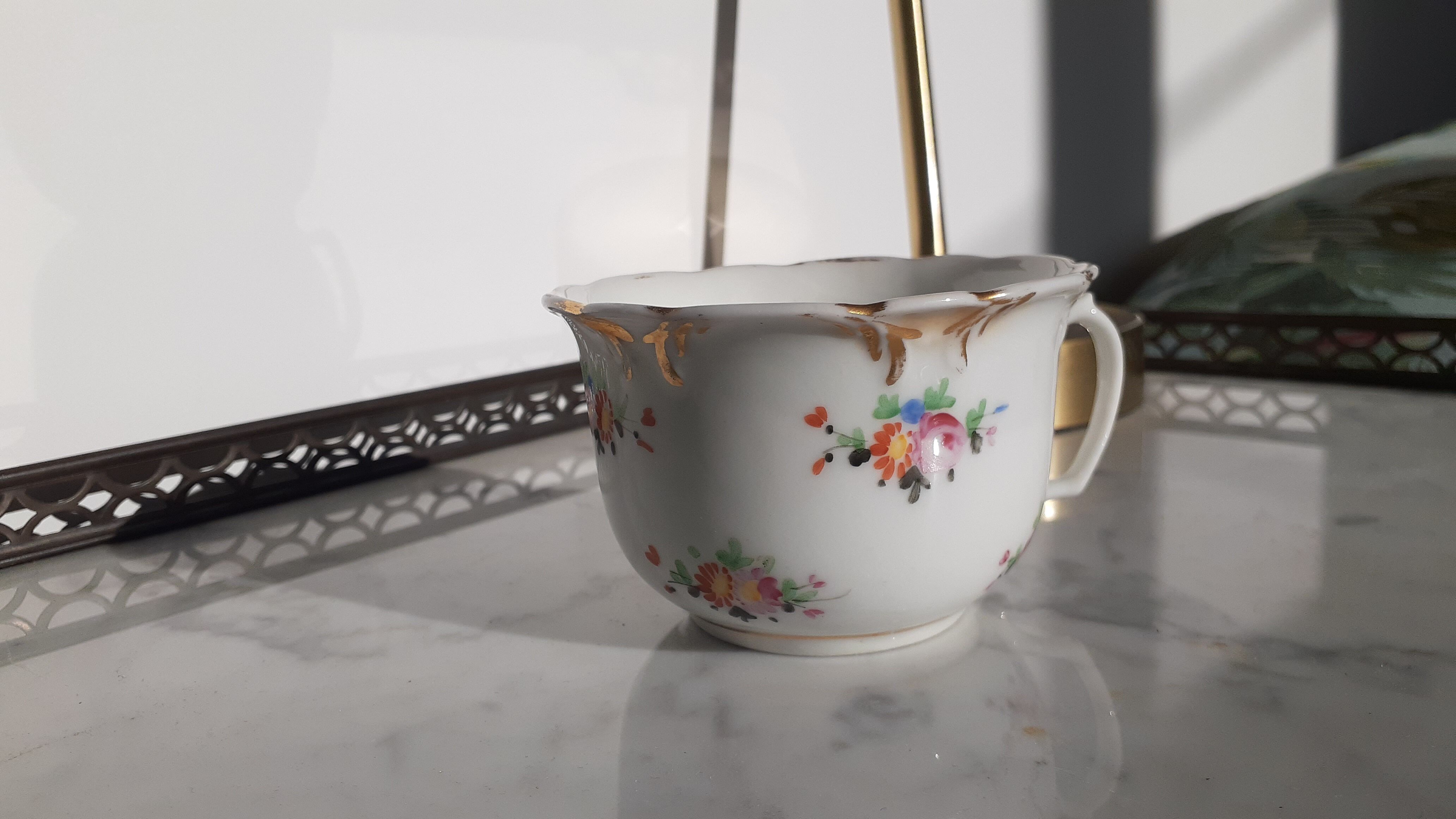 Antique flowered porcelain cup