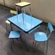 Vintage set from the 60s/70s: table, chairs, and marbled Formica stools.