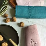 Set of four old damask towels tinted in multiple colors