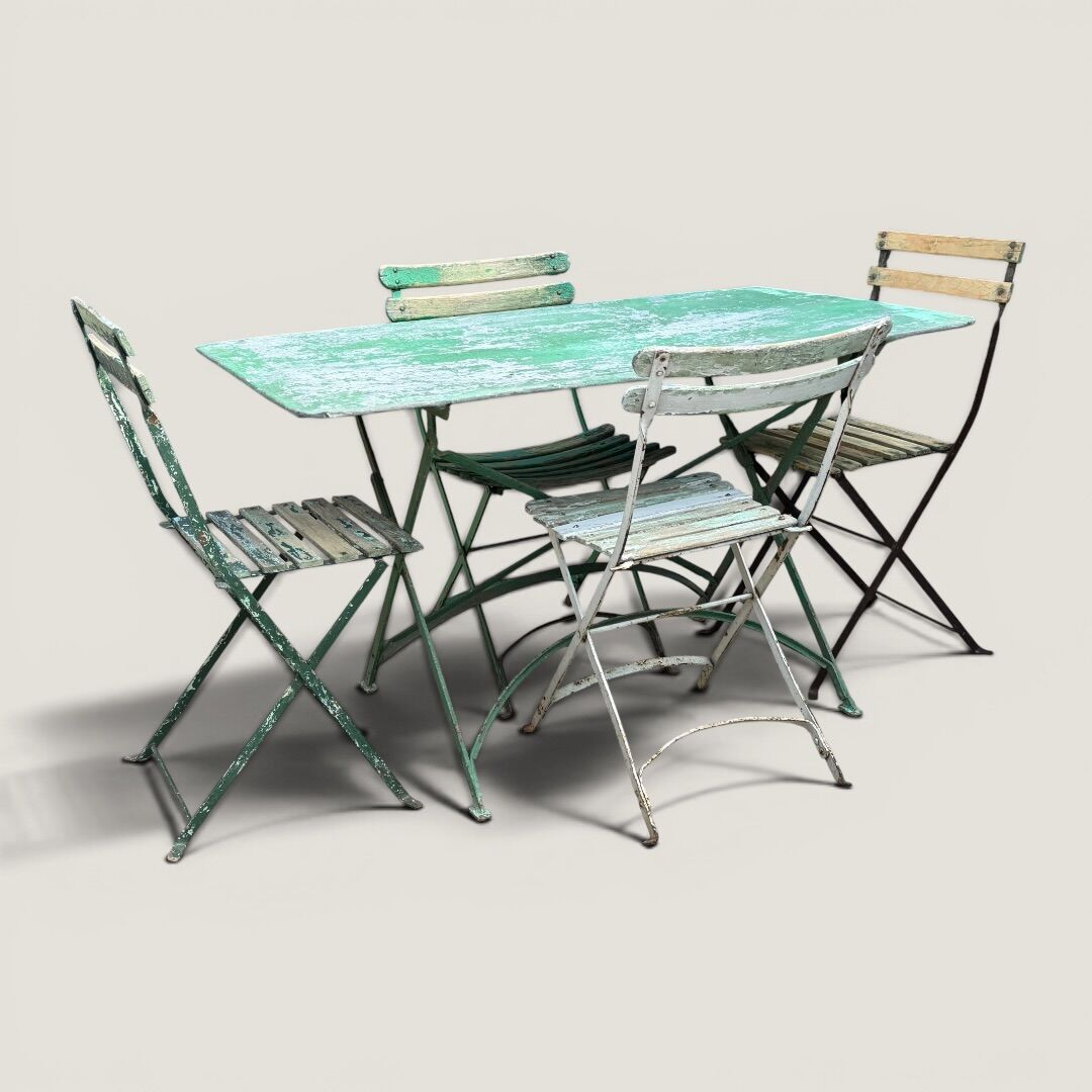 Bistro tables and folding chairs with a patina from the original 1930s.