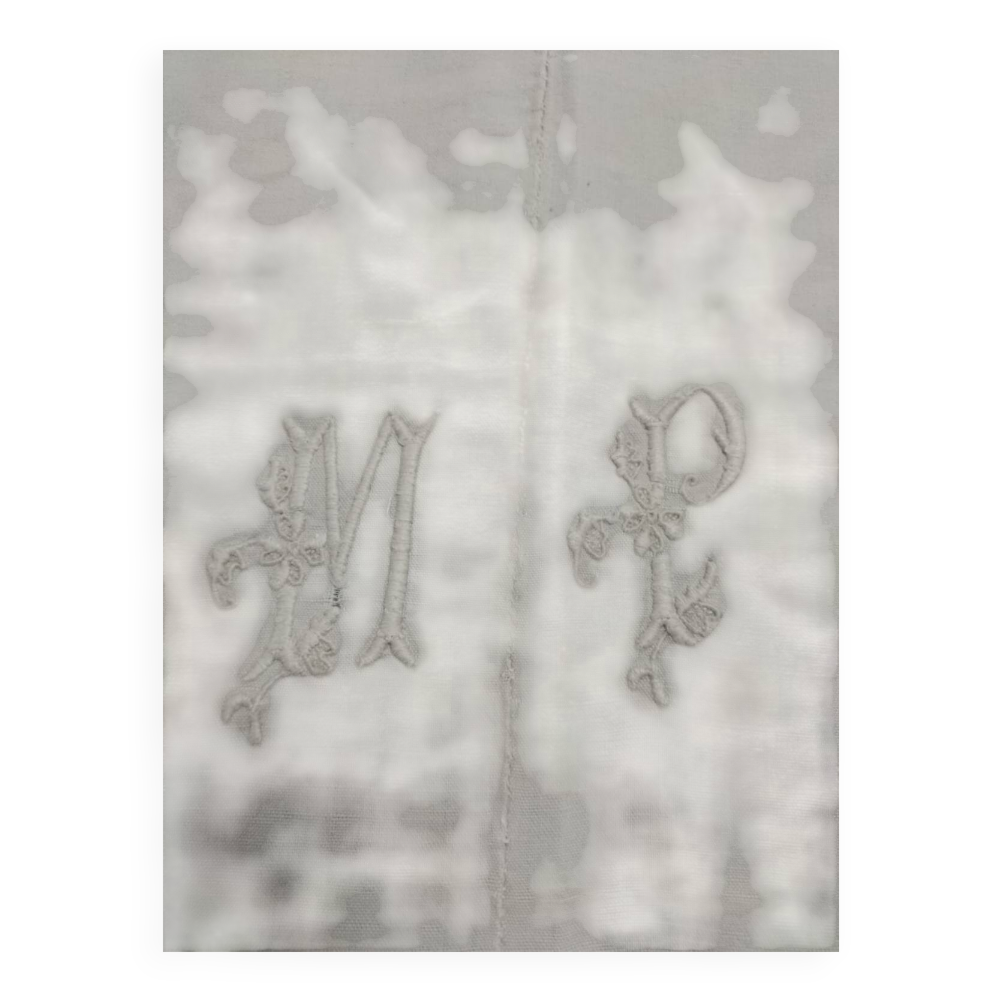 Old fabric, embroidered with the monogram MP.