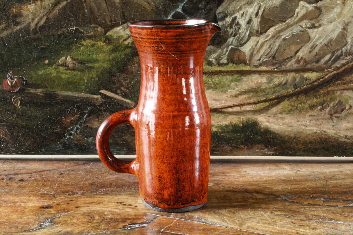 Signed orange ceramic candle holder and jug