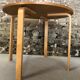Round dining table in vintage wood