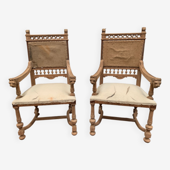 Pair of renaissance style armchairs in carved walnut XX century
