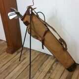 Old golf bag with 5 golf clubs