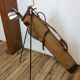 Old golf bag with 5 golf clubs