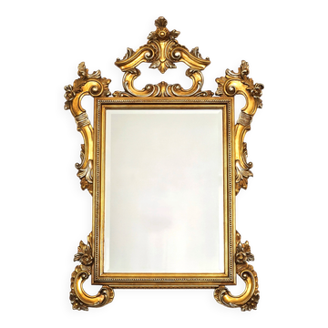 Large Italian mirror in carved wood, traditional gilding, 1980s.