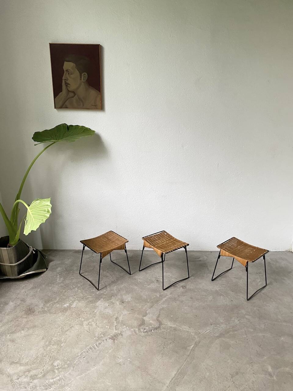 Set of three Raoul Guys wicker and metal stools