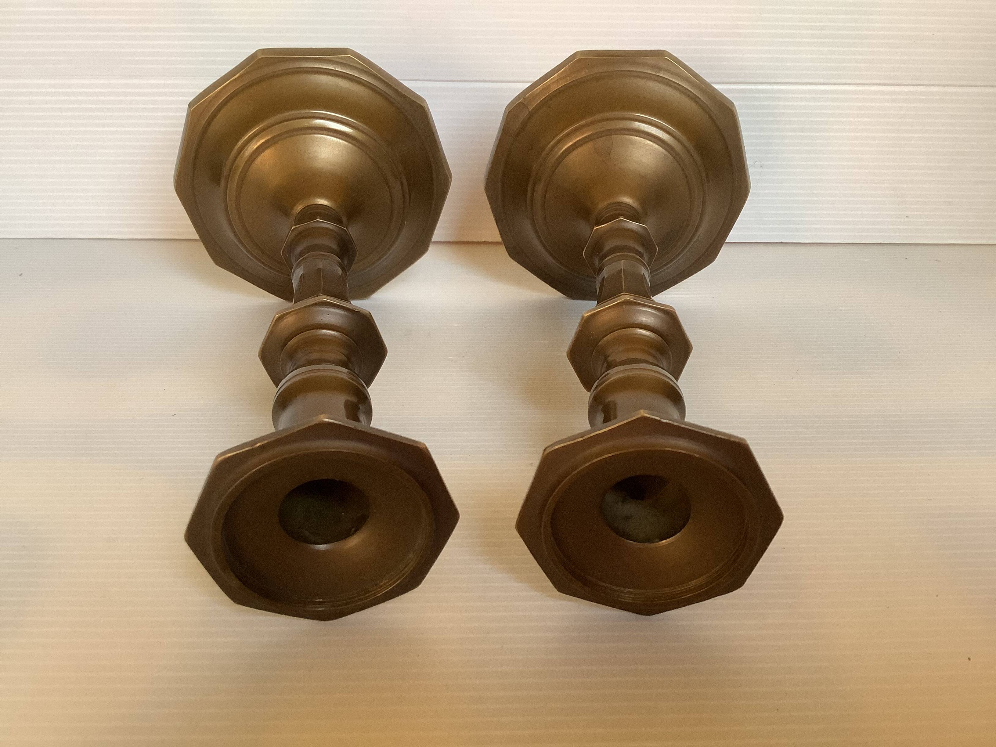 Four brass candle holders