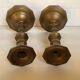 Four brass candle holders