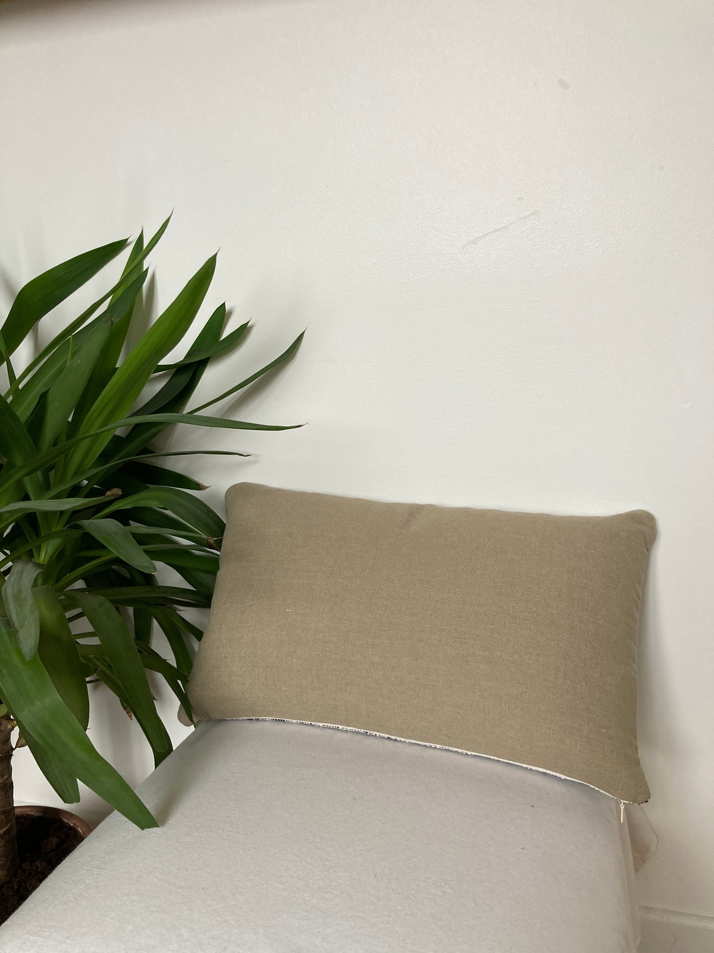 Bi-sided cushion beige black white pattern