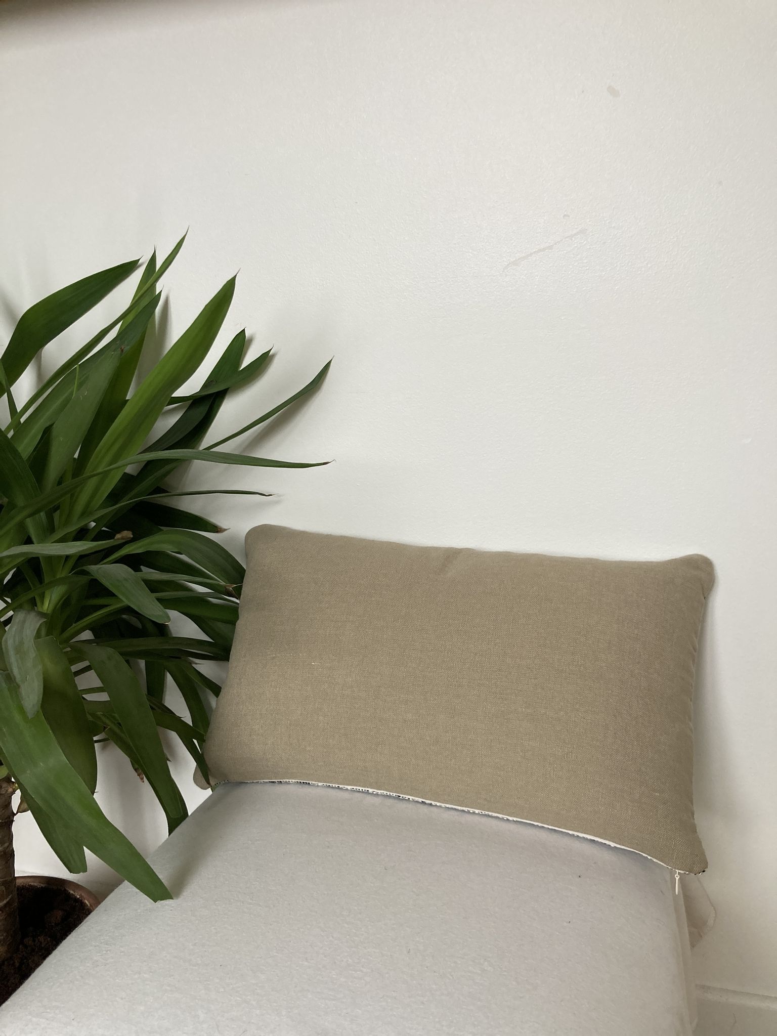 Bi-sided cushion beige black white pattern