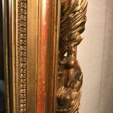 Large antique mirror with flagship shell in wood and gilded stucco