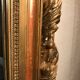 Large antique mirror with flagship shell in wood and gilded stucco