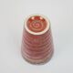 Small orange glazed ceramic cup