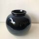 Glazed blue ceramic vase