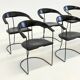 Ensemble de 8 chaises de salle à manger vintage Arrben Ursala en cuir noir.