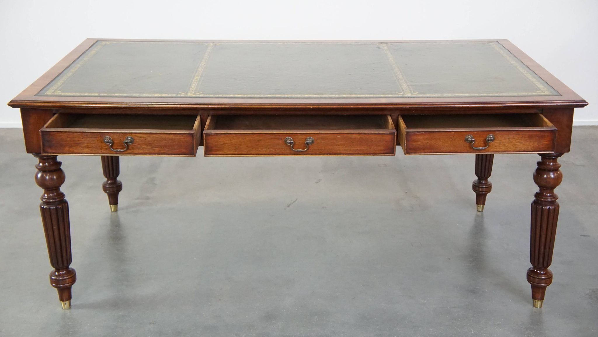 Large writing desk with green leather top, elegant legs and 3 English style drawers
