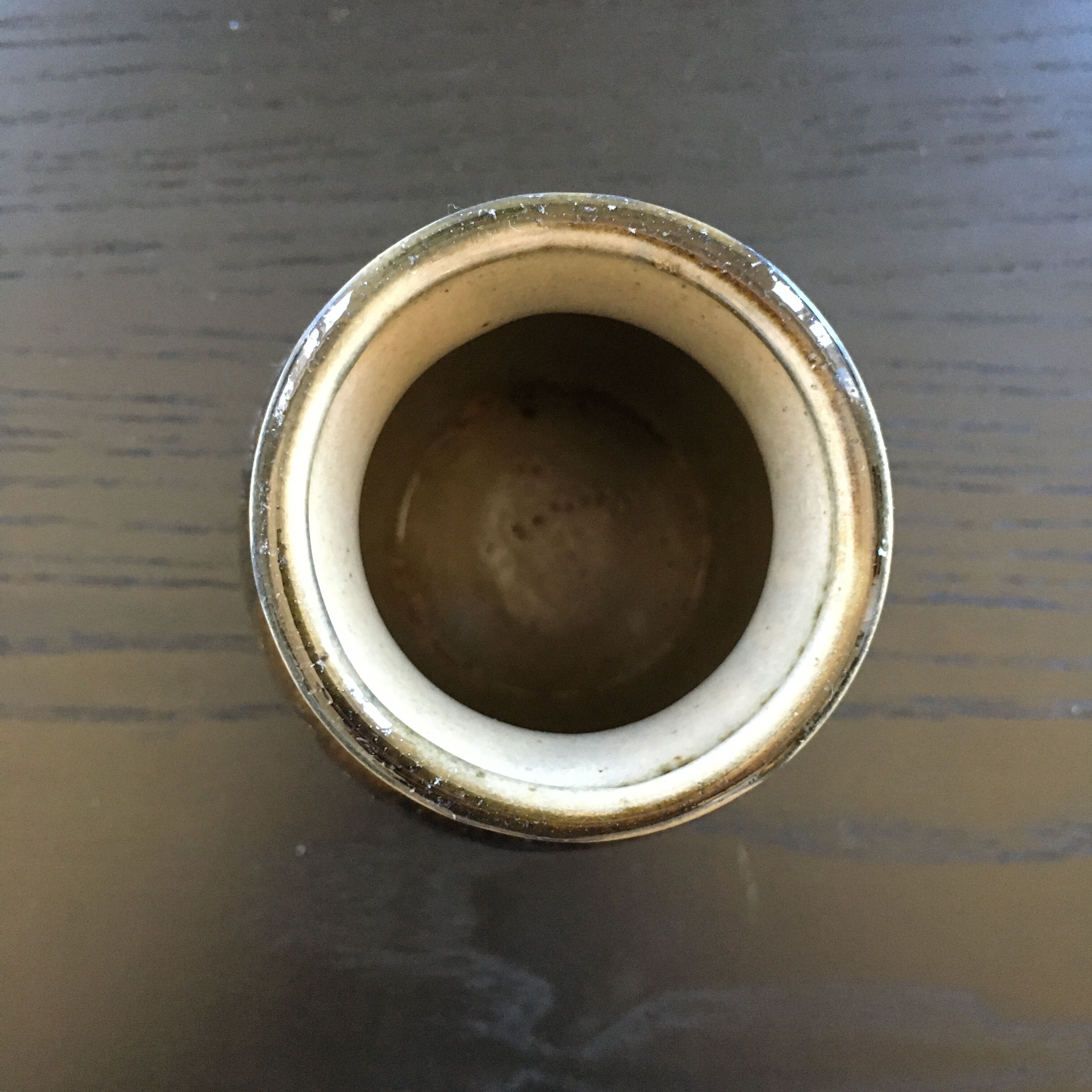 Brown and black flame-colored vase