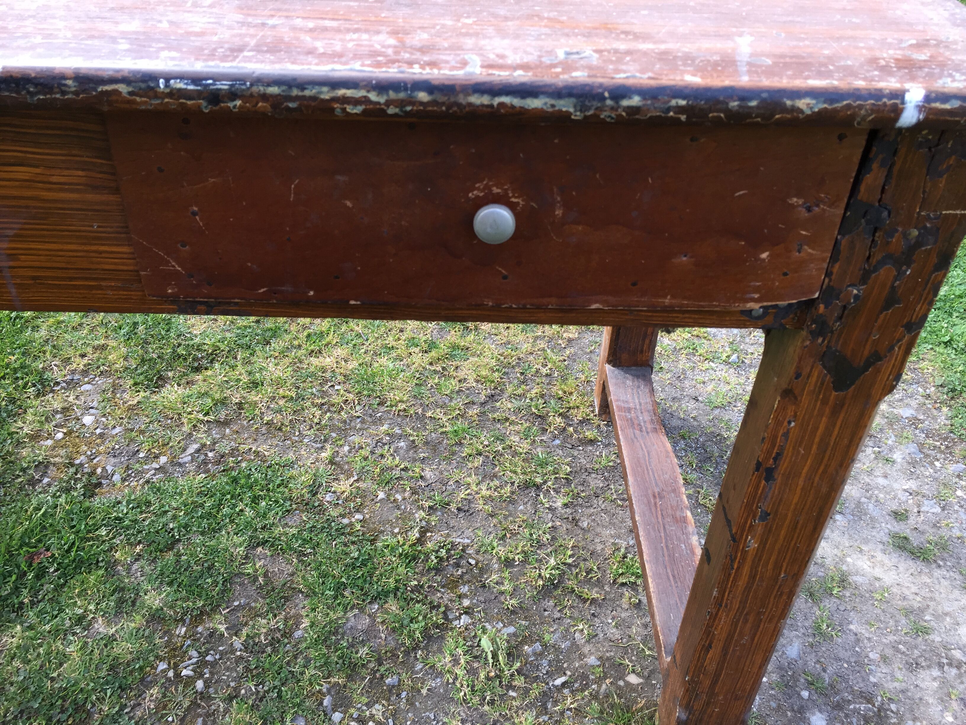 Old farmhouse table in oak painted faux wood old painting.