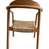 solid wood chair with woven seat and armrests