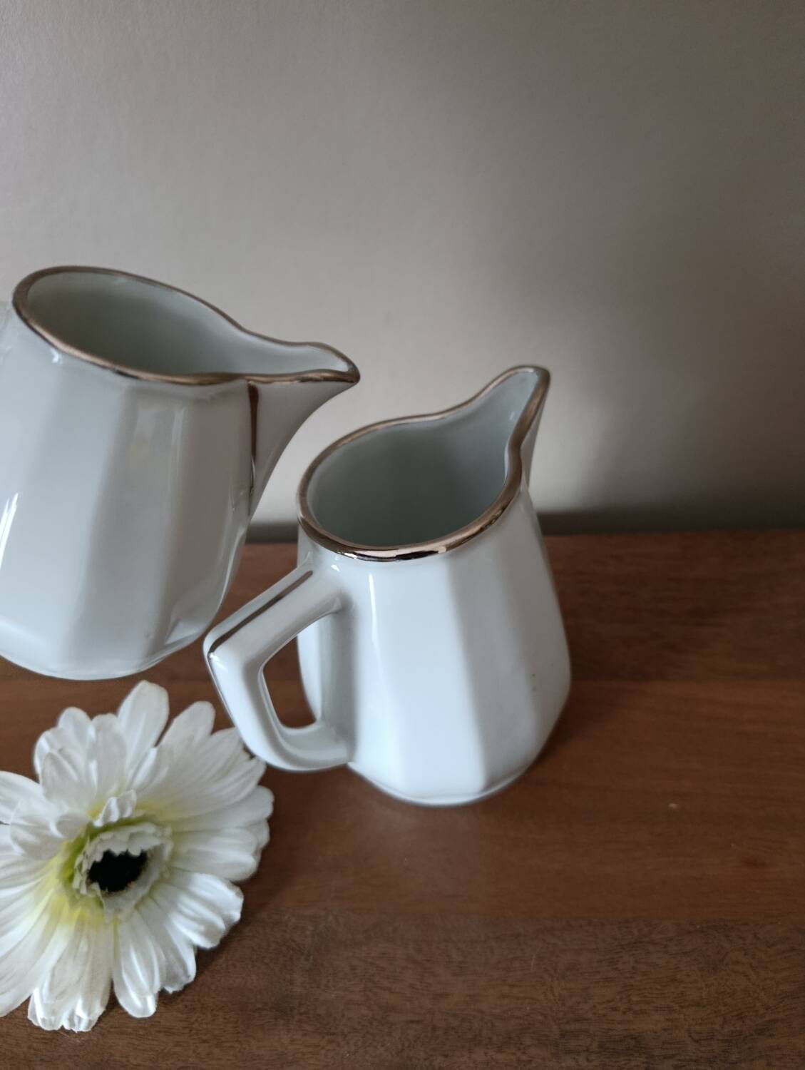2 white porcelain milk jugs with platinum trim, Flora by Apilco.