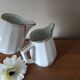 2 white porcelain milk jugs with platinum trim, Flora by Apilco.