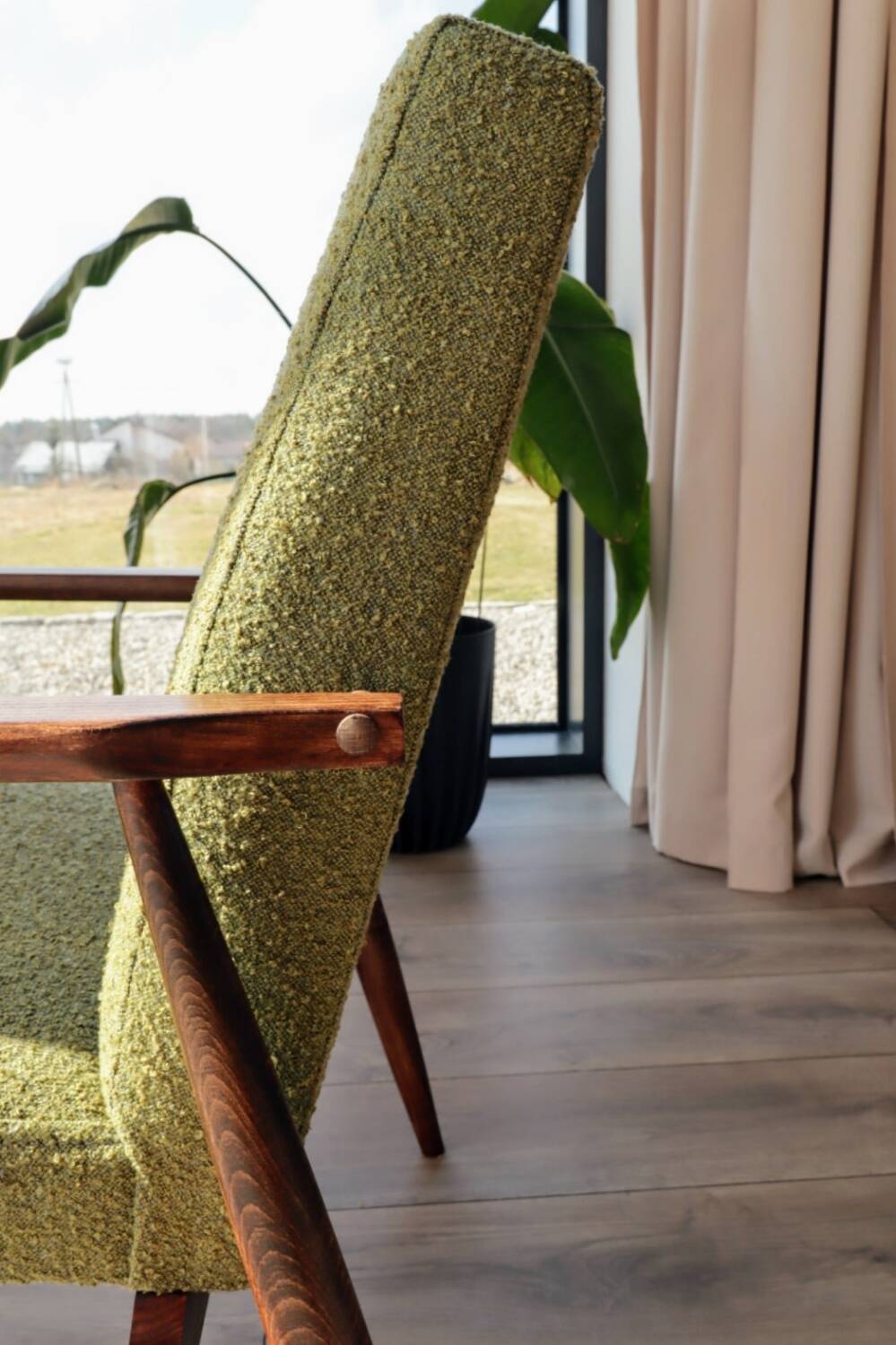 Mid-century modern armchair in olive green bouclé design by H. Lis.