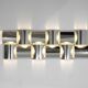 Contemporary wall light in stainless steel and metal.
