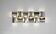Contemporary wall light in stainless steel and metal.