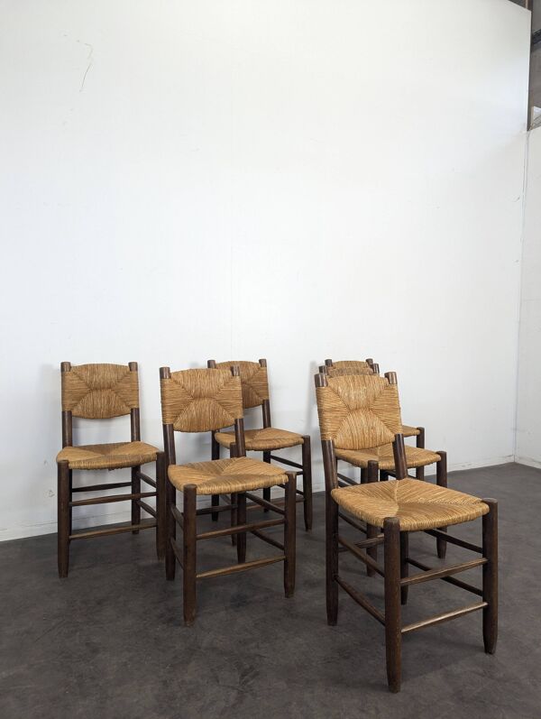 Série de 10 chaises modèle Bauche par Charlotte Perriand, circa 1960