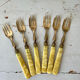 Brass and bakelite dessert cutlery