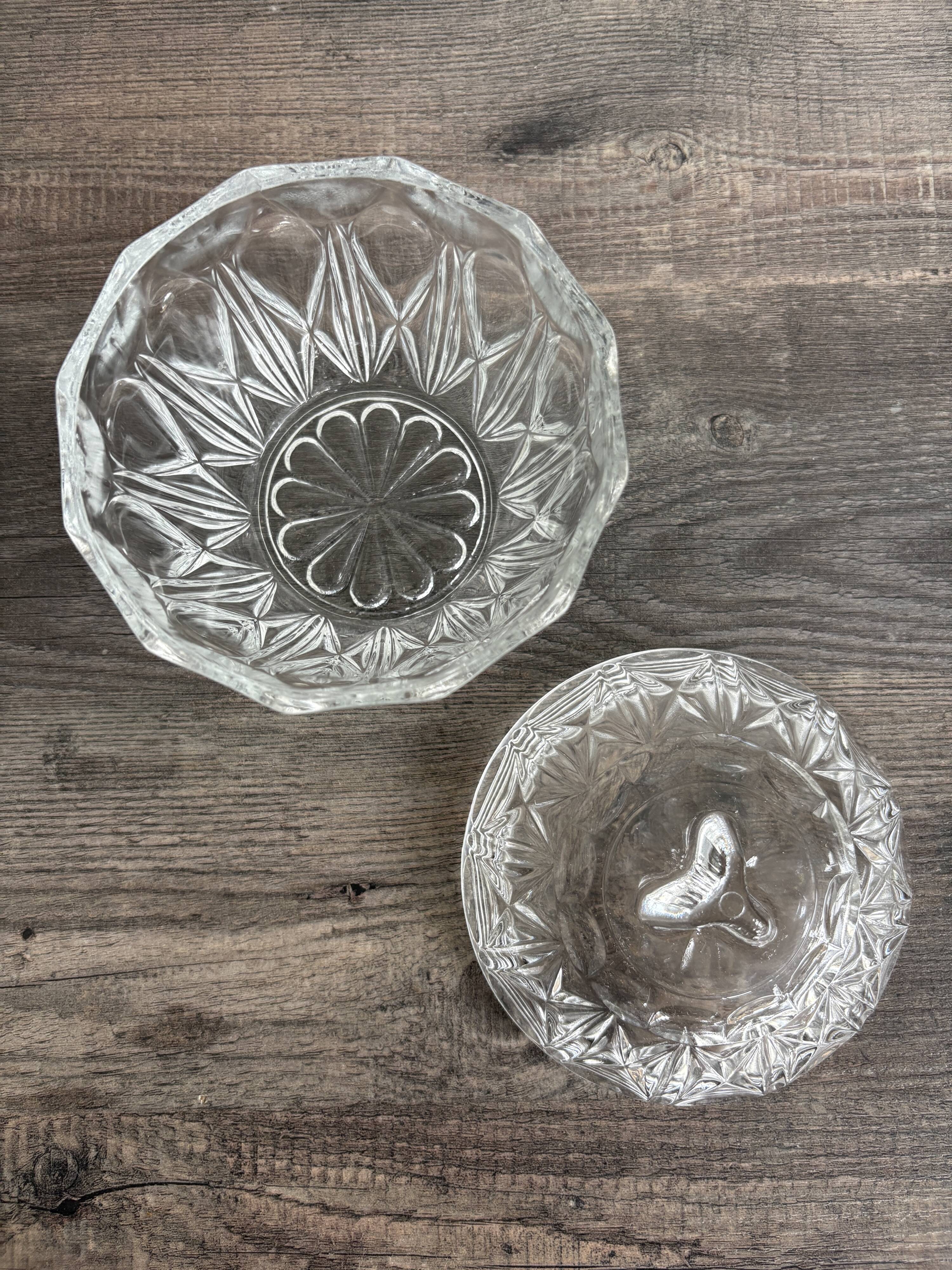 Antique covered jar in chiseled glass