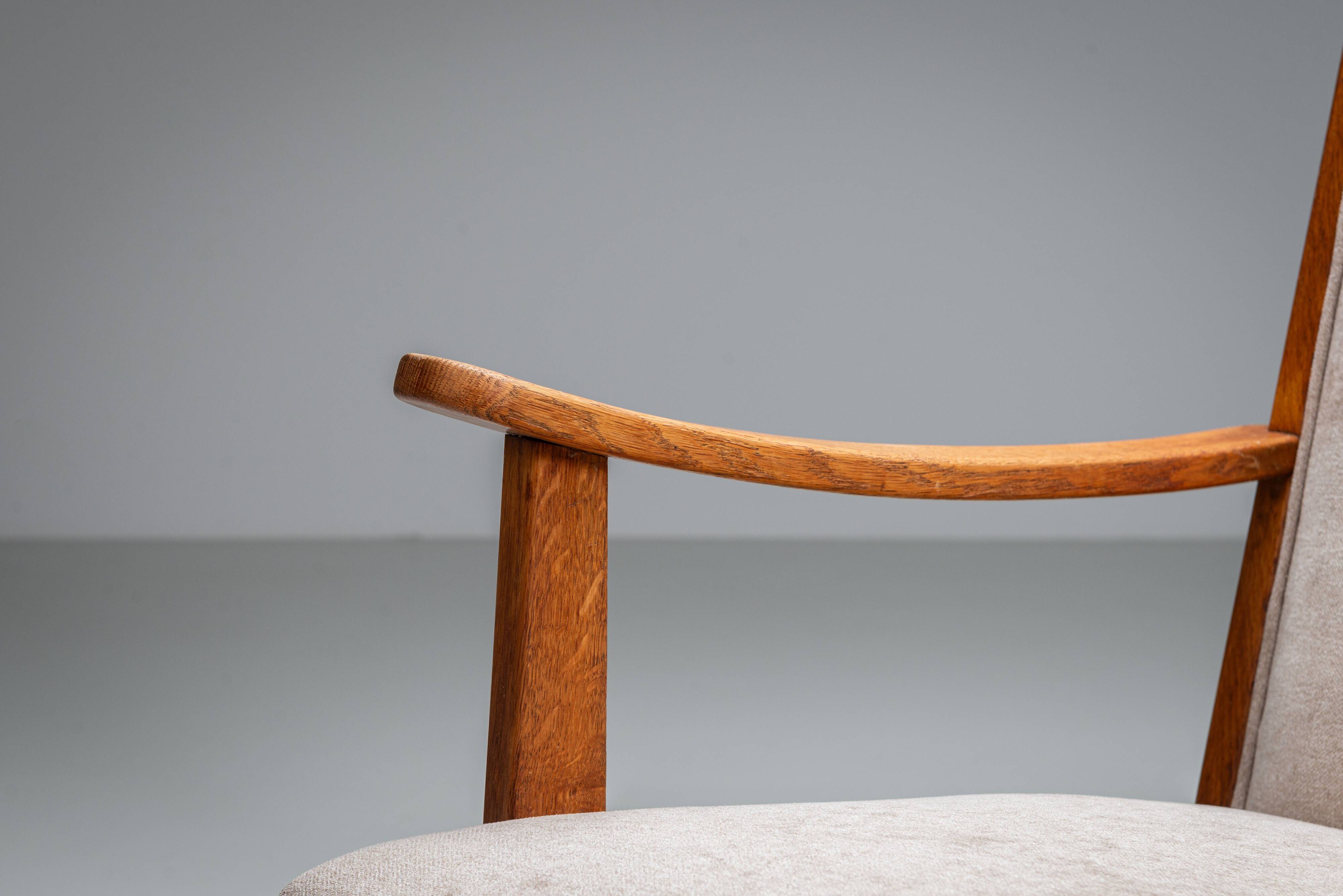 Oak armchair with curved armrests