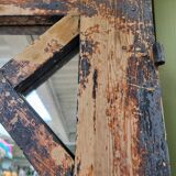 Wooden mirror mounted on old door