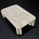 Antona travertine coffee table by the Italian publisher Up&Up.