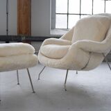 Womb Chair and Ottoman in fluffy white fabric by Eero Saarinen