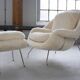 Womb Chair and Ottoman in fluffy white fabric by Eero Saarinen
