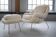 Womb Chair and Ottoman in fluffy white fabric by Eero Saarinen