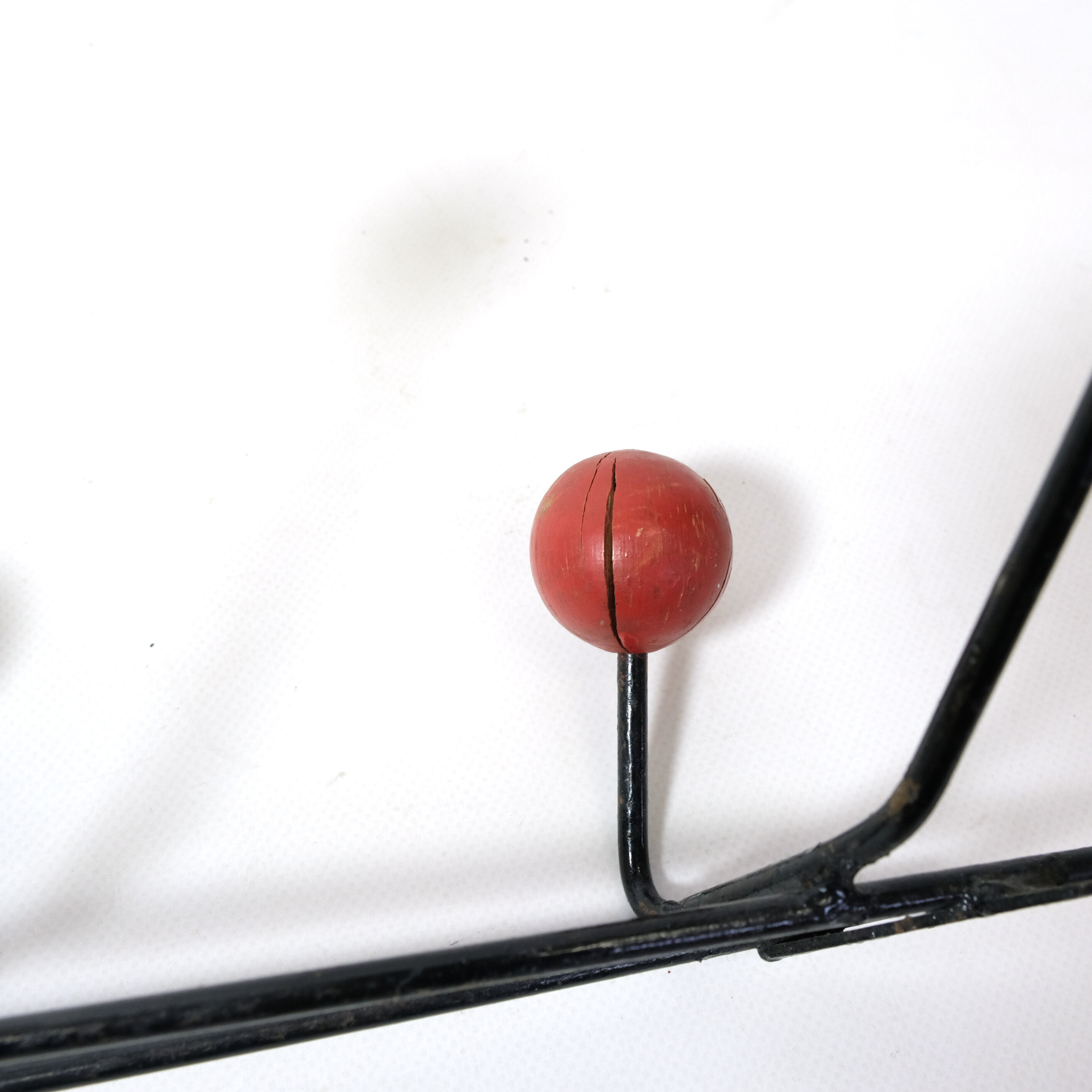 Multicolored wooden and metal coat holder
