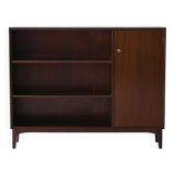 Vintage bookshelf with a door