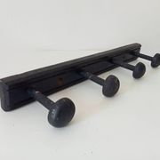 Old wooden wall coat rack